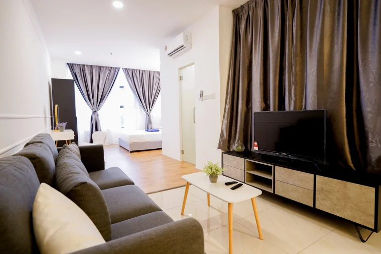 Spacious apartment interior featuring modern furnishings, polished floors, air conditioning, and thoughtful layout design