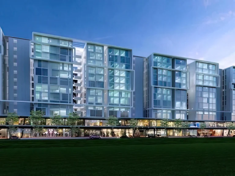 Contemporary residential complex featuring blue glass buildings and ground-floor commercial spaces